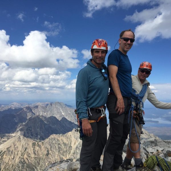 Christian, Jim and Bill celebrate on the summit of the Grand Teton after completing the Cathedral Traverse.